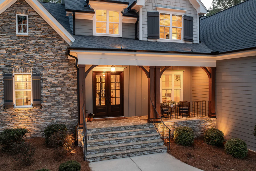 Twilight exterior of a rental property with the interior lights on